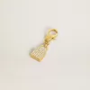 Anhänger in Form eines Schlosses aus goldfarbenem Messing mit Kristallen