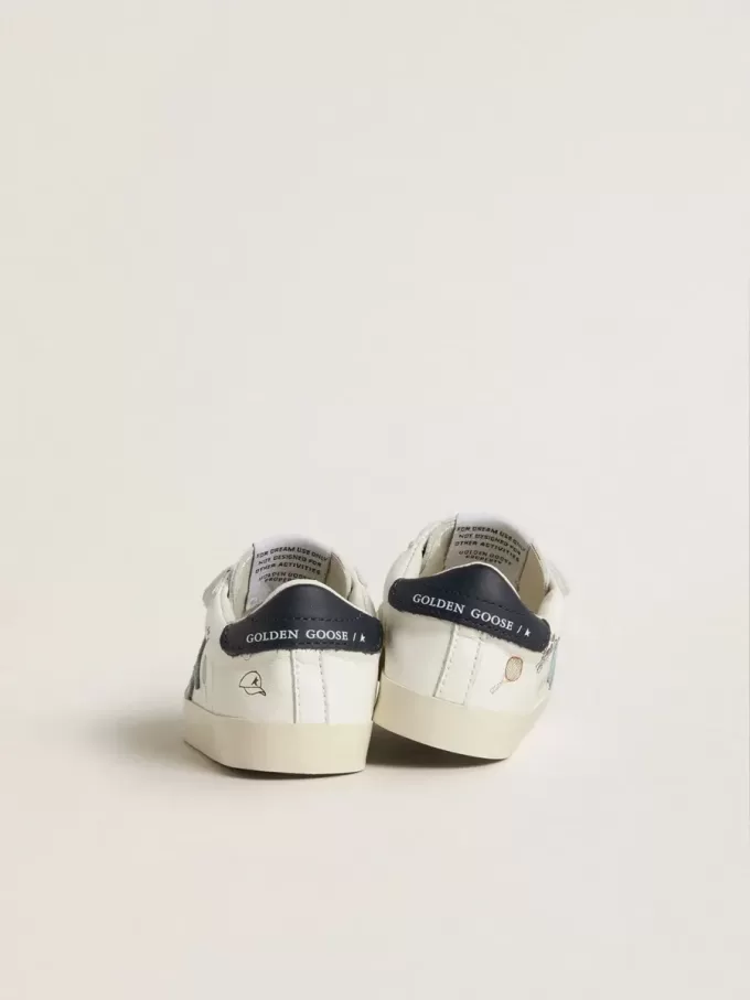 Baby School aus weißem Nappaleder mit hellblauem Wildlederstern und Tennismotiv Baby School aus weißem Nappaleder mit hellblauem Wildlederstern und Tennismotiv