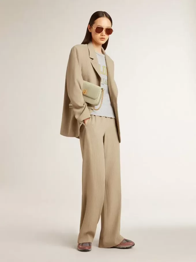 Beigefarbene Damenjacke mit Nadelstreifen und einreihiger Knopfleiste in Oversize-Passform Beigefarbene Damenjacke mit Nadelstreifen und einreihiger Knopfleiste in Oversize-Passform