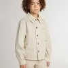 Beigefarbene Kinderjacke mit bunten Sprenkeln Beigefarbene Kinderjacke mit bunten Sprenkeln