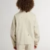 Beigefarbene Kinderjacke mit bunten Sprenkeln Beigefarbene Kinderjacke mit bunten Sprenkeln