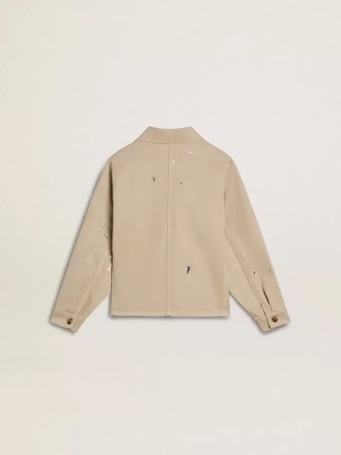 Beigefarbene Kinderjacke mit bunten Sprenkeln Beigefarbene Kinderjacke mit bunten Sprenkeln
