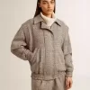 Bomberjacke für Damen aus ecru-brauner Wolle mit Fischgrätenmuster Bomberjacke für Damen aus ecru-brauner Wolle mit Fischgrätenmuster