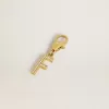 Buchstabe F-Anhänger aus goldfarbenem Messing mit Kristallen