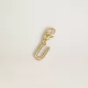 Buchstabe U-Anhänger aus goldfarbenem Messing mit Kristallen