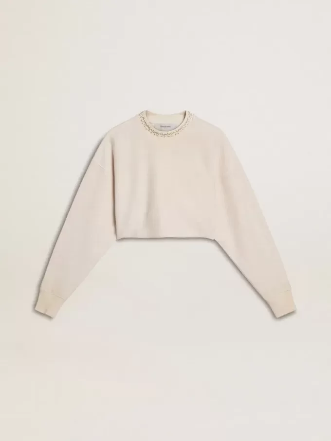 Cremefarbenes, kurz geschnittenes Sweatshirt für Damen aus Baumwolle mit Kristallen auf der Vorderseite Cremefarbenes, kurz geschnittenes Sweatshirt für Damen aus Baumwolle mit Kristallen auf der Vorderseite