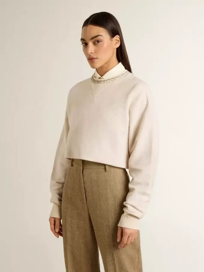 Cremefarbenes, kurz geschnittenes Sweatshirt für Damen aus Baumwolle mit Kristallen auf der Vorderseite Cremefarbenes, kurz geschnittenes Sweatshirt für Damen aus Baumwolle mit Kristallen auf der Vorderseite