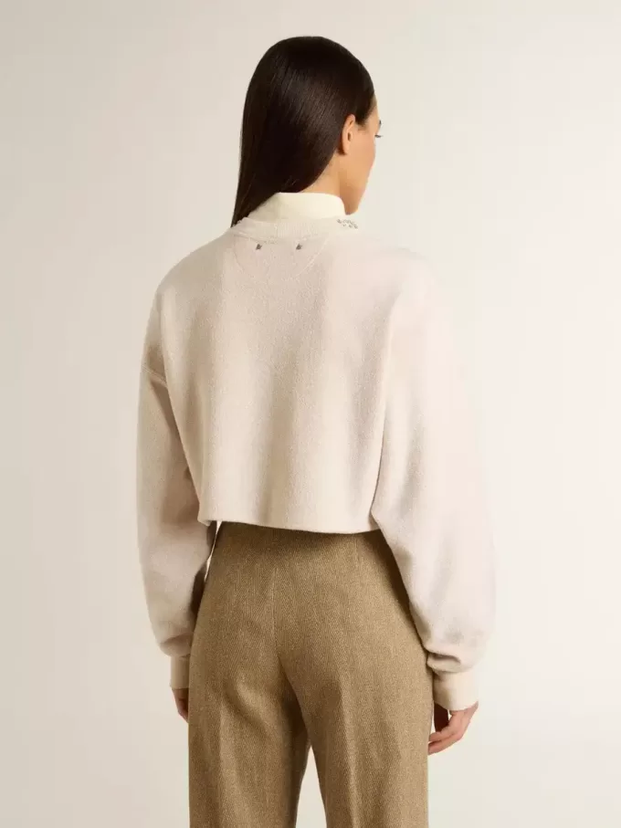 Cremefarbenes, kurz geschnittenes Sweatshirt für Damen aus Baumwolle mit Kristallen auf der Vorderseite Cremefarbenes, kurz geschnittenes Sweatshirt für Damen aus Baumwolle mit Kristallen auf der Vorderseite