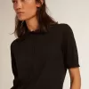 Damen-Poloshirt aus schwarzer Merinowolle Damen-Poloshirt aus schwarzer Merinowolle