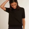 Damen-Poloshirt aus schwarzer Merinowolle Damen-Poloshirt aus schwarzer Merinowolle