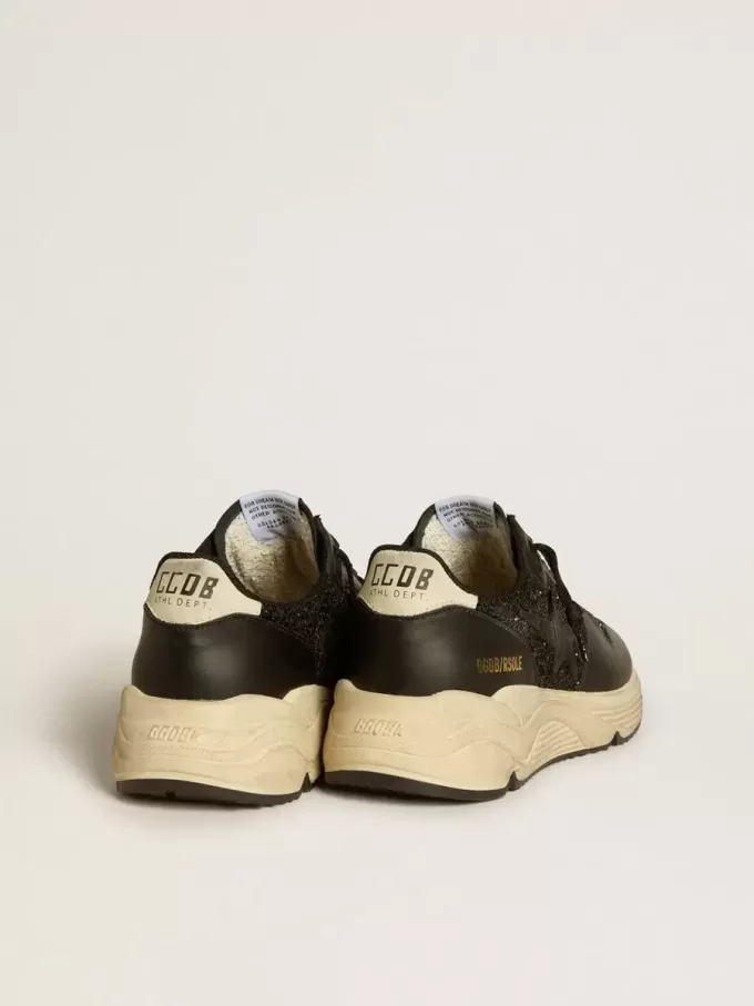 Damen-Sneaker „Running Sole” in Schwarz mit Glitzer, Lederstern und Fersenlasche aus Nubukleder Damen-Sneaker „Running Sole” in Schwarz mit Glitzer, Lederstern und Fersenlasche aus Nubukleder