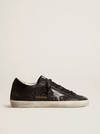 Damen-Superstar aus schwarzem Nappa und Glitzer mit glänzendem schwarzen Lederstern