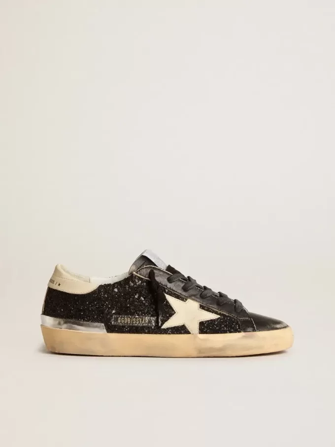 Damen-Superstar in schwarzem Glitzer und Nappa mit cremefarbenem Lederstern und Fersenlasche