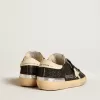 Damen-Superstar in schwarzem Glitzer und Nappa mit cremefarbenem Lederstern und Fersenlasche