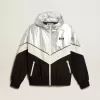 Damen-Windjacke aus silbernem und schwarzem Funktionsstoff Damen-Windjacke aus silbernem und schwarzem Funktionsstoff