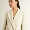 Damenblazer aus weiß-grauer Wollmischung mit Nadelstreifen und kurzen Ärmeln Damenblazer aus weiß-grauer Wollmischung mit Nadelstreifen und kurzen Ärmeln