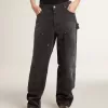 Damenjeans aus schwarzem Baumwollstoff im Distressed-Look mit Patches auf der Vorderseite