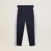 Dunkelblaue Jogginghose mit weißem Streifen und kontrastierenden Sternen Dunkelblaue Jogginghose mit weißem Streifen und kontrastierenden Sternen