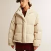 Gepolsterte Öko-Daunenjacke mit Reißverschluss und Kapuze Gepolsterte Öko-Daunenjacke mit Reißverschluss und Kapuze