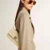 Gioia Tasche aus mineralgrauem Schafsleder mit goldenen Details