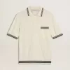 Herren-Polohemd in Used-Weiß mit blauen Rippbündchen Herren-Polohemd in Used-Weiß mit blauen Rippbündchen