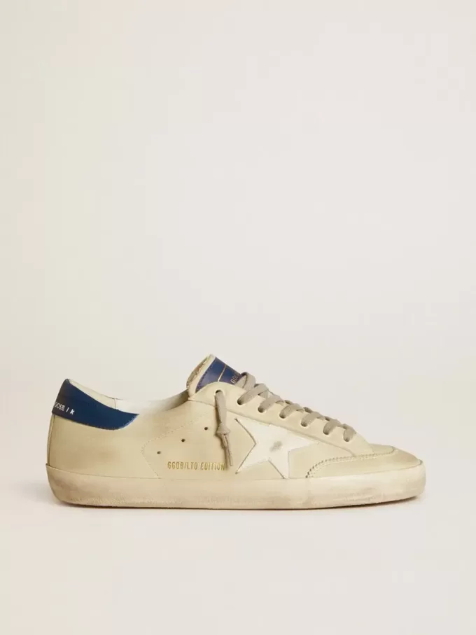 Herren-Super-Star LTD aus Nubukleder mit weißem Lederstern und blauer Fersenlasche Herren-Super-Star LTD aus Nubukleder mit weißem Lederstern und blauer Fersenlasche