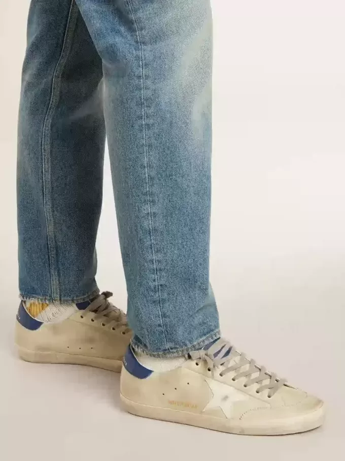 Herren-Super-Star LTD aus Nubukleder mit weißem Lederstern und blauer Fersenlasche Herren-Super-Star LTD aus Nubukleder mit weißem Lederstern und blauer Fersenlasche