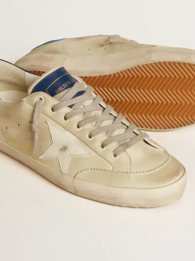 Herren-Super-Star LTD aus Nubukleder mit weißem Lederstern und blauer Fersenlasche Herren-Super-Star LTD aus Nubukleder mit weißem Lederstern und blauer Fersenlasche