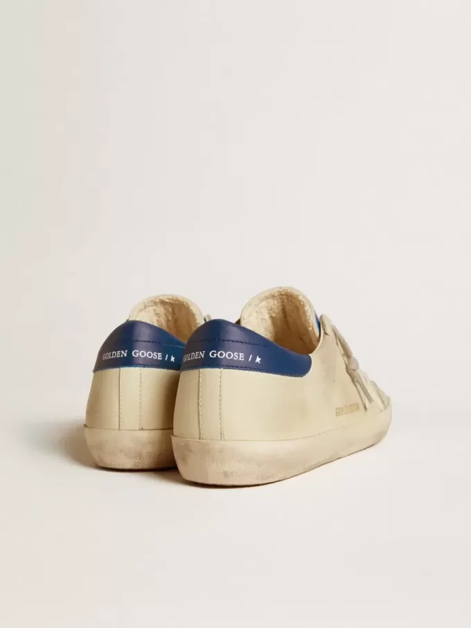 Herren-Super-Star LTD aus Nubukleder mit weißem Lederstern und blauer Fersenlasche Herren-Super-Star LTD aus Nubukleder mit weißem Lederstern und blauer Fersenlasche