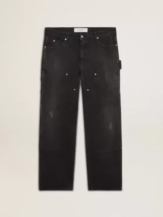 Herrenjeans aus schwarzem Baumwollstoff im Distressed-Look mit Aufnähern auf der Vorderseite Herrenjeans aus schwarzem Baumwollstoff im Distressed-Look mit Aufnähern auf der Vorderseite