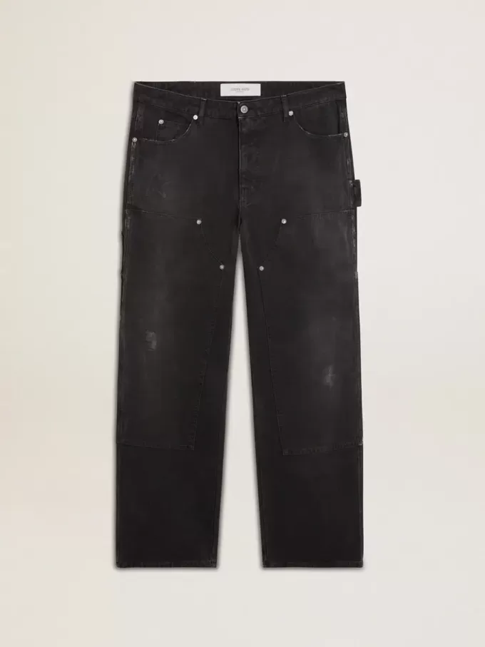 Herrenjeans aus schwarzem Baumwollstoff im Distressed-Look mit Aufnähern auf der Vorderseite Herrenjeans aus schwarzem Baumwollstoff im Distressed-Look mit Aufnähern auf der Vorderseite
