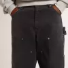 Herrenjeans aus schwarzem Baumwollstoff im Distressed-Look mit Aufnähern auf der Vorderseite Herrenjeans aus schwarzem Baumwollstoff im Distressed-Look mit Aufnähern auf der Vorderseite