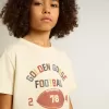 Jungen-T-Shirt in Used-Weiß mit mehrfarbigem Schriftzug Jungen-T-Shirt in Used-Weiß mit mehrfarbigem Schriftzug