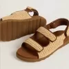 Junior-Sandalen „Noa” aus beigem Raffia und braunem Leder Junior-Sandalen „Noa” aus beigem Raffia und braunem Leder