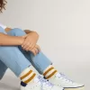 Junior Super-Star aus weißem Leder mit blauem Wildleder-Fersenriemen