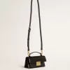 Kleine Venezia-Tasche aus schwarzem Leder mit Golddetails Kleine Venezia-Tasche aus schwarzem Leder mit Golddetails
