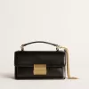 Kleine Venezia-Tasche aus schwarzem Leder mit Golddetails Kleine Venezia-Tasche aus schwarzem Leder mit Golddetails
