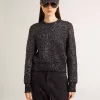 Kurzer Damenpullover aus schwarzer Wollmischung mit durchgehenden Pailletten Kurzer Damenpullover aus schwarzer Wollmischung mit durchgehenden Pailletten