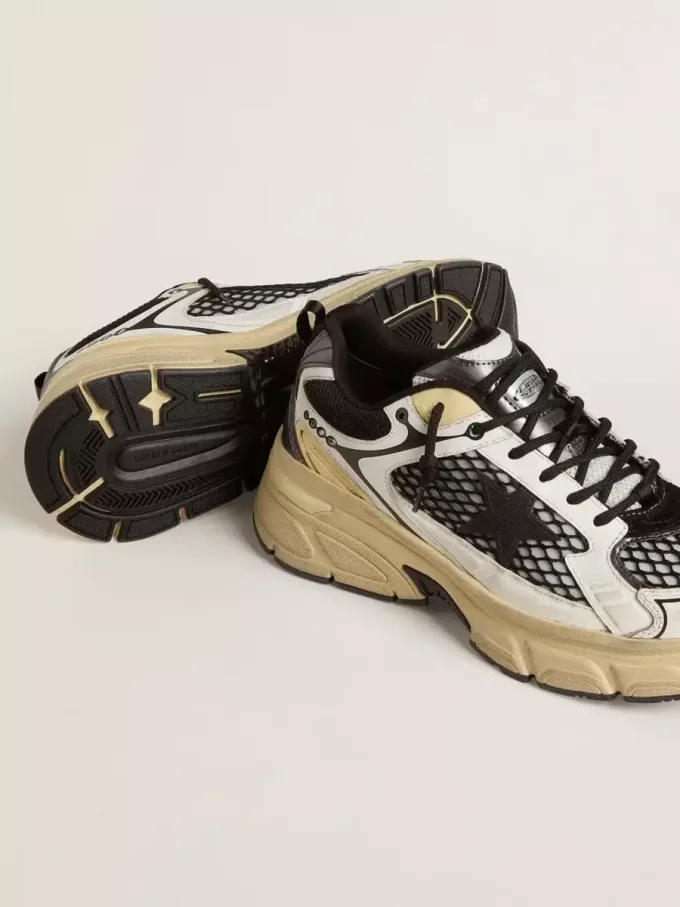 Lightstar für Herren aus weißem Leder und schwarzem Mesh mit schwarzem TPU-Stern Lightstar für Herren aus weißem Leder und schwarzem Mesh mit schwarzem TPU-Stern