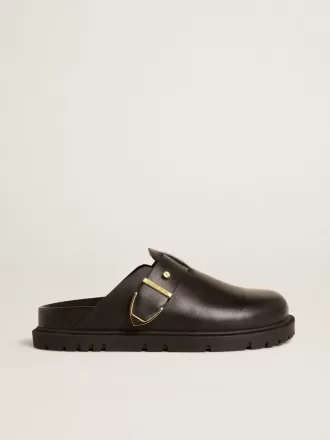 Lucy Sabot für Damen aus glänzendem schwarzem Leder mit goldener Metallschnalle Lucy Sabot für Damen aus glänzendem schwarzem Leder mit goldener Metallschnalle