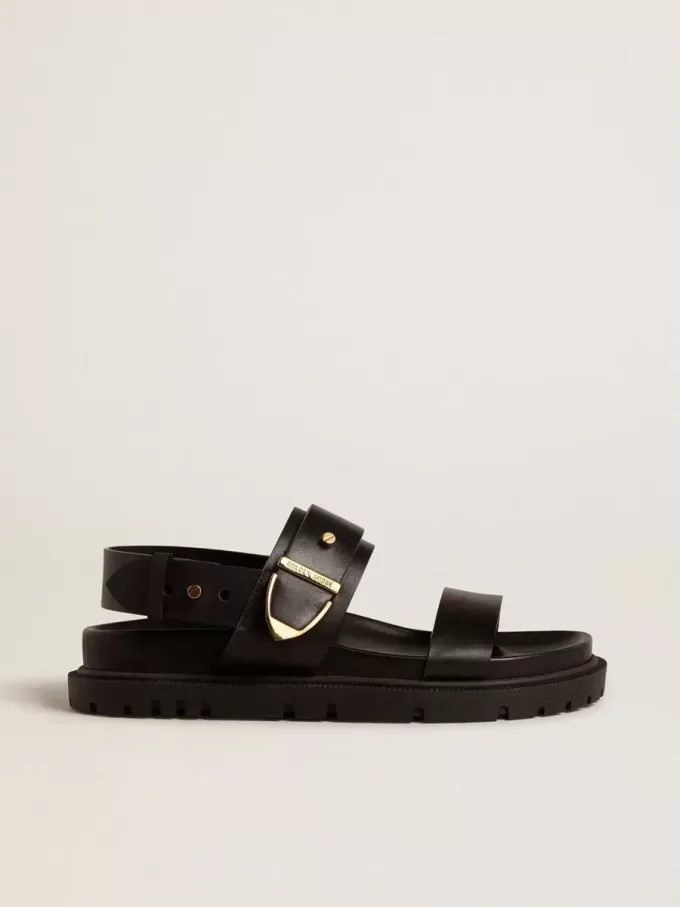 Lucy Sandale für Damen aus glänzendem schwarzem Leder mit goldener Metallschnalle Lucy Sandale für Damen aus glänzendem schwarzem Leder mit goldener Metallschnalle