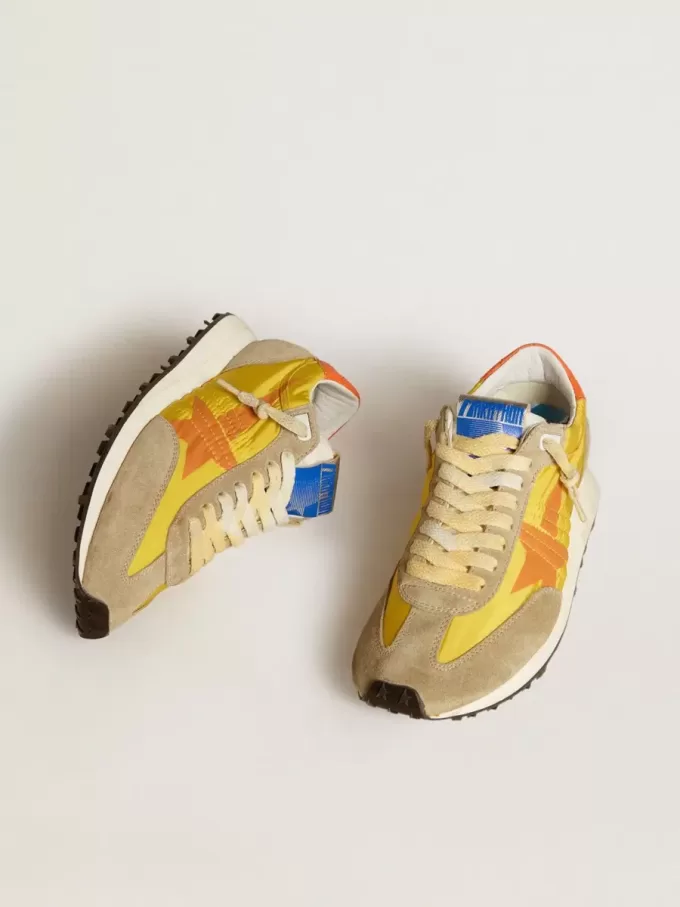 Marathon für Damen mit gelbem Nylon-Obermaterial und orangefarbenem Stern Marathon für Damen mit gelbem Nylon-Obermaterial und orangefarbenem Stern