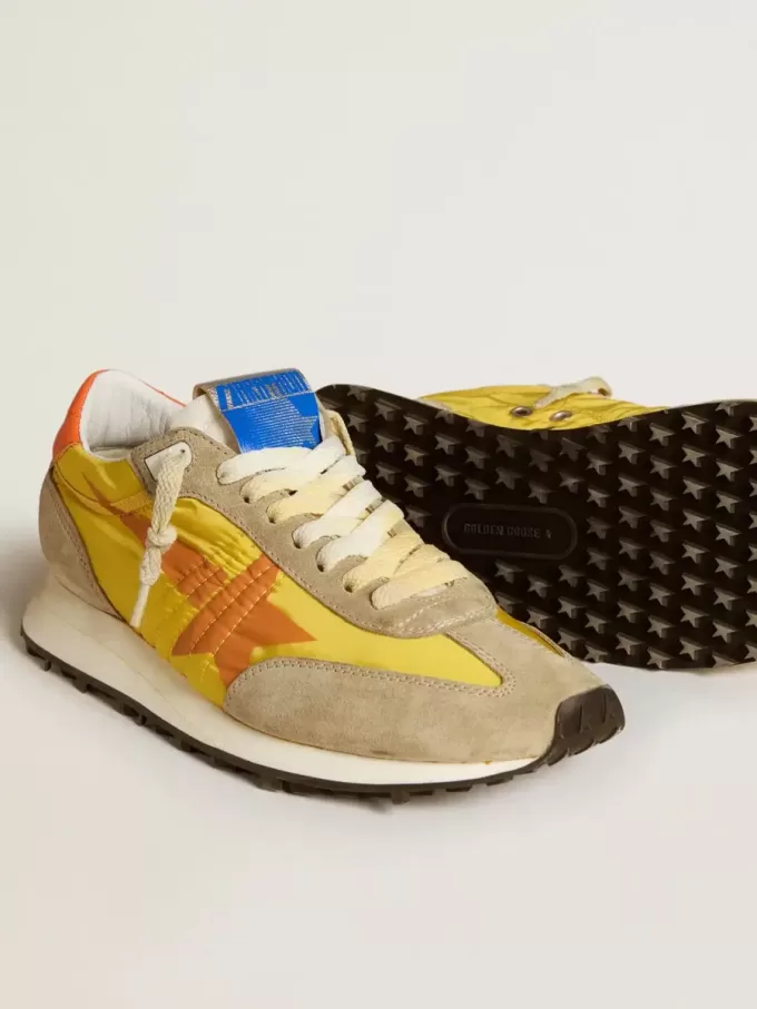 Marathon für Damen mit gelbem Nylon-Obermaterial und orangefarbenem Stern Marathon für Damen mit gelbem Nylon-Obermaterial und orangefarbenem Stern