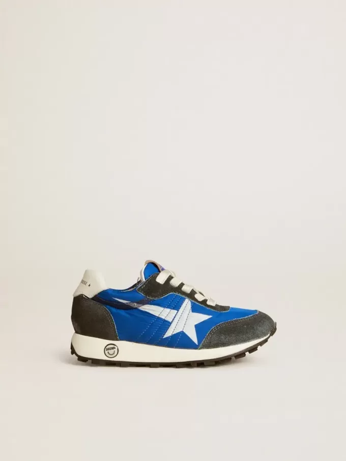 Marathon Junior aus blauem Nylon mit aufgedrucktem Stern und Lederlasche an der Ferse