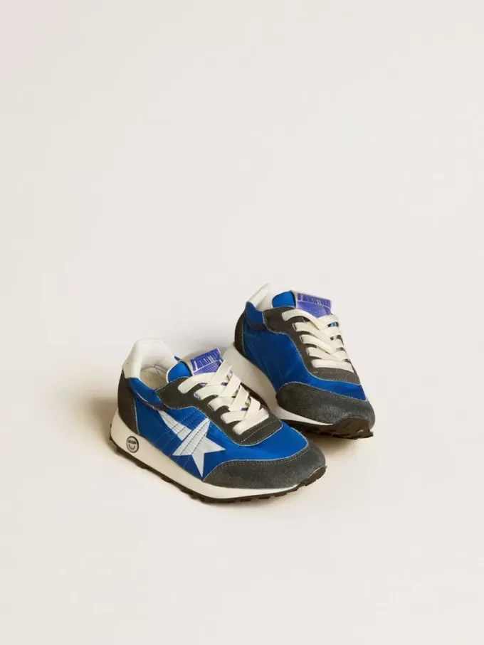 Marathon Junior aus blauem Nylon mit aufgedrucktem Stern und Lederlasche an der Ferse