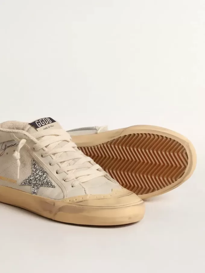 Mid Star LTD mit Glitzerstern und metallischem Lederbesatz