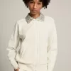 Papyrusweißes Sweatshirt mit Reißverschluss und Kristallkragen aus der Denise Star Collection