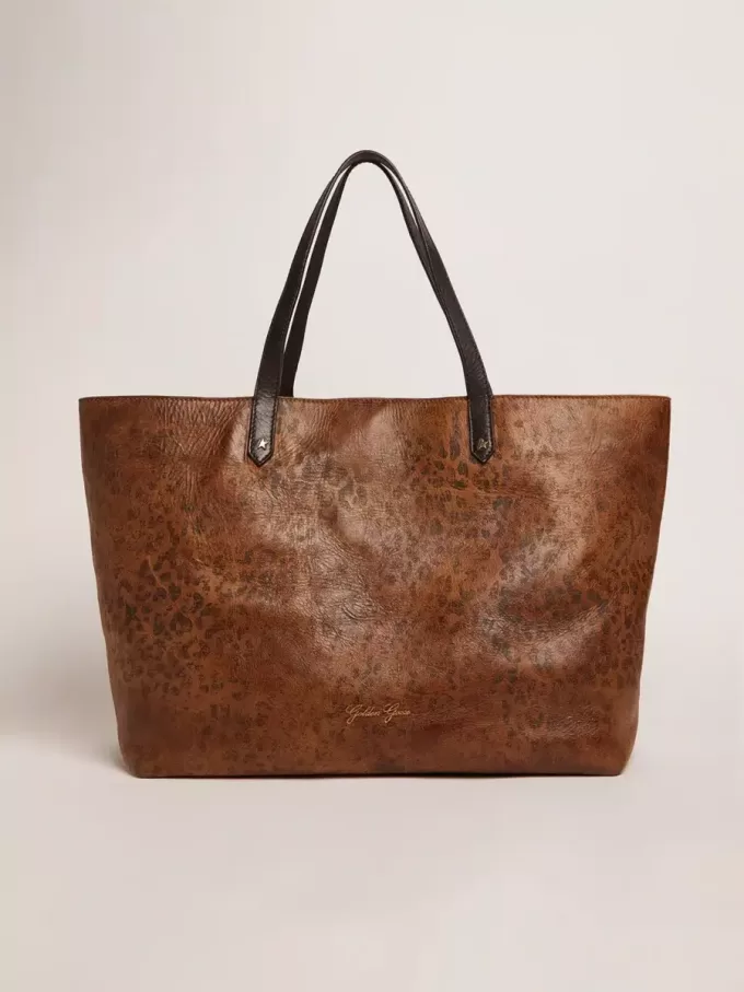 Pasadena-Tasche aus gehämmertem Leder mit Leopardenmuster und kontrastierenden schwarzen Griffen Pasadena-Tasche aus gehämmertem Leder mit Leopardenmuster und kontrastierenden schwarzen Griffen