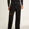 Schwarze Herrenjeans mit lockerer Passform und Kristallen mit Farbverlaufseffekt Schwarze Herrenjeans mit lockerer Passform und Kristallen mit Farbverlaufseffekt