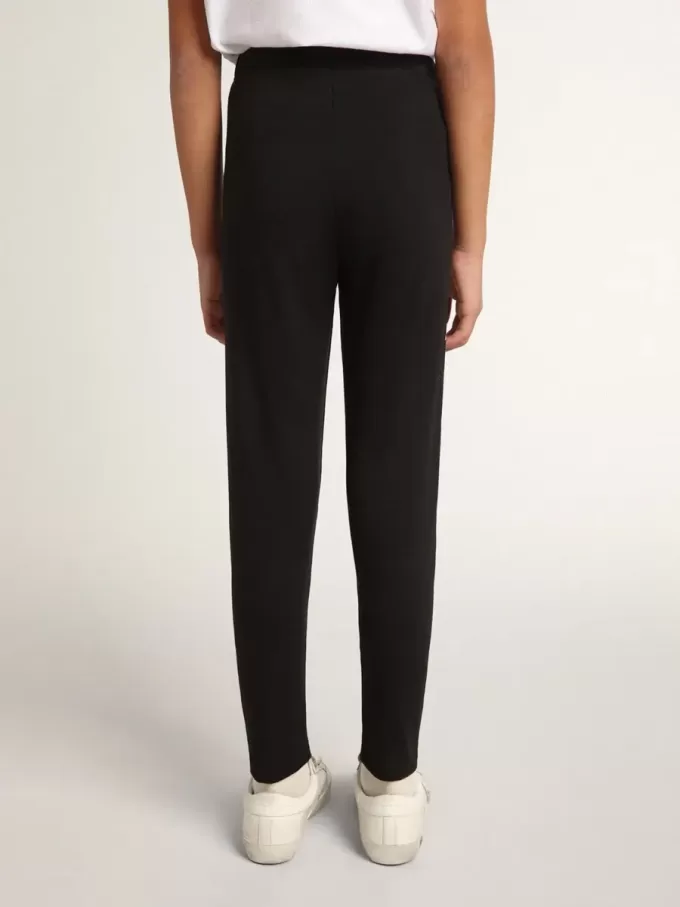Schwarze Leggings für Mädchen mit weißen Sternen an den Seiten Schwarze Leggings für Mädchen mit weißen Sternen an den Seiten